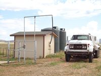 Well house with storage tanks and loading station