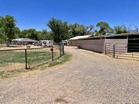 Circular driveway by horse barn to home